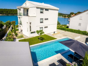 Villa Veronica with pool and boat mooring first line at sea